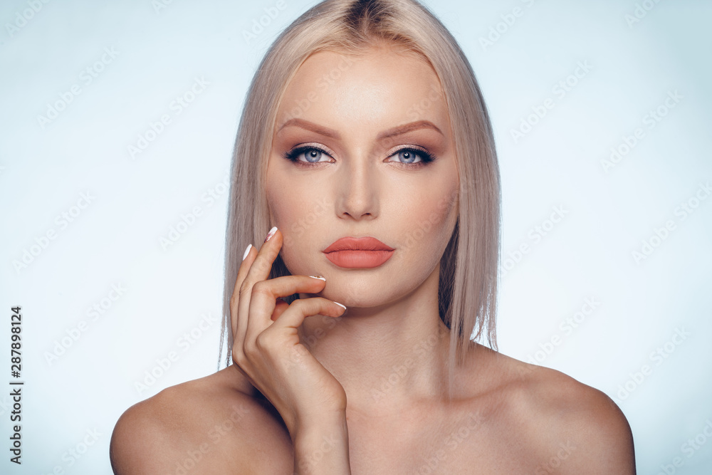 Close up beauty portrait of a blonde woman with perfect skin and plump lips Close up beauty portrait of a blonde woman with perfect skin and plump lips