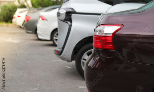 Closeup of rear side of purple car parking in parking area. © Amphon