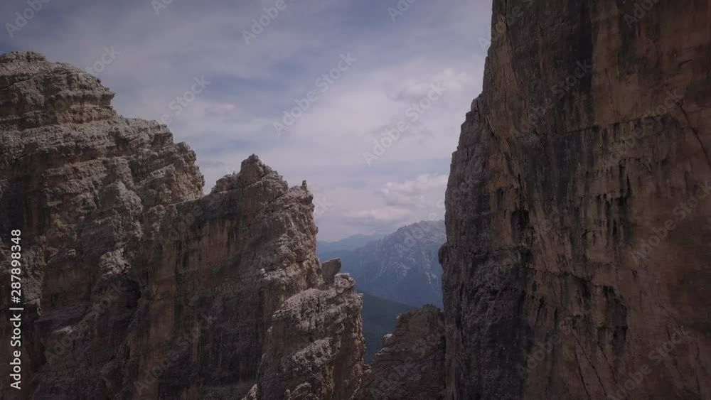 Drone aerial view of Popena peaks in Dolomites at summer season up to Misurina lake near Cortina D'Ampezzo. Drone aerial view of Popena peaks in Dolomites at summer season up to Misurina lake near Cortina D'Ampezzo.