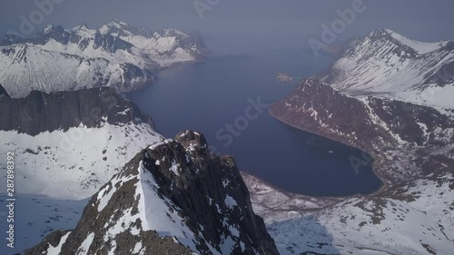 Drone aerial video from the Keipen peak at Senja Island in Spring season with snow. photo