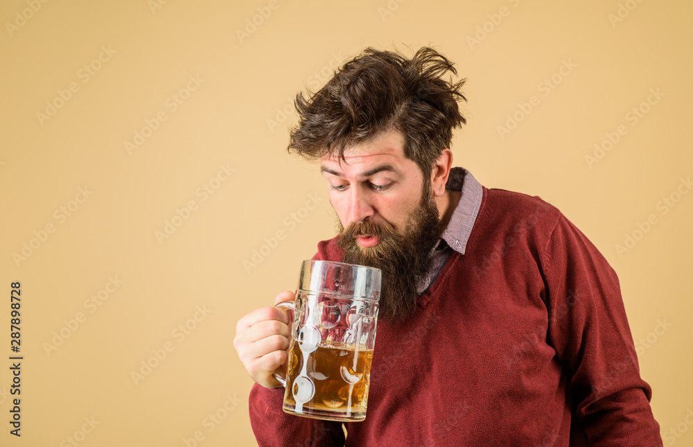 Oktoberfest festival. Tasting fresh brewed beer. Barman. Brewer holds glass with craft beer. Brewery concept. Man with beer of mug. Alcohol. Male brewer holds glass with beer. Oktober fest. Brewer. Oktoberfest festival. Tasting fresh brewed beer. Barman. Brewer holds glass with craft beer. Brewery concept. Man with beer of mug. Alcohol. Male brewer holds glass with beer. Oktober fest. Brewer.