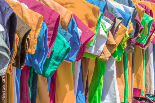 colorful tee-shirts for sale at the market photo
