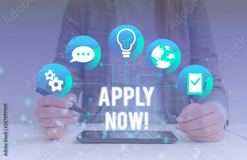 Conceptual hand writing showing Apply Now. Concept meaning request something officially in writing or by sending in form Female human wear formal work suit presenting smart device