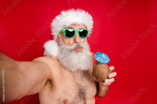 Self-portrait of his he nice attractive funky gray-haired man enjoying leisure free time having fun drinking fresh tasty juice tourist spa resort rest relax isolated over bright vivid shine red #287901987