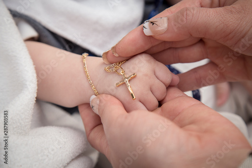 Fotobehang baptism holy cross necklace