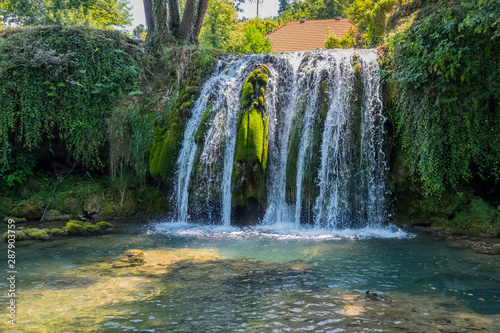 Scenic waterfall cascades on the river Sluncica. Magnificent Southern Europe  Croatia  small town Slunj. Beautiful day. The concept of ecological  active and photo tourism