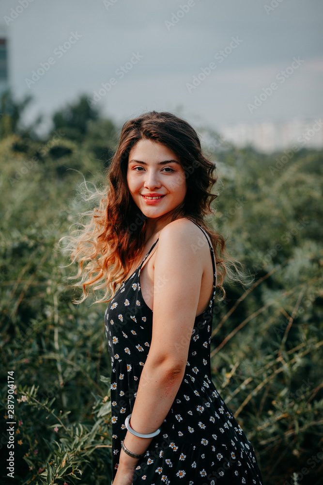 Young girl in summer time full of joy and harmony