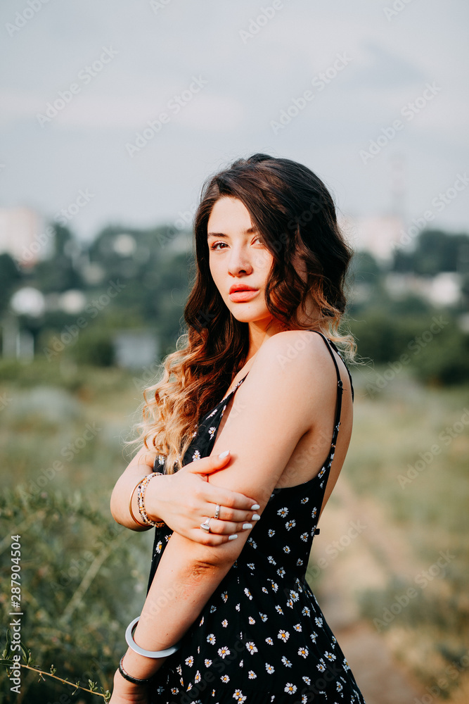 Fototapeta premium Young girl in summer time full of joy and harmony