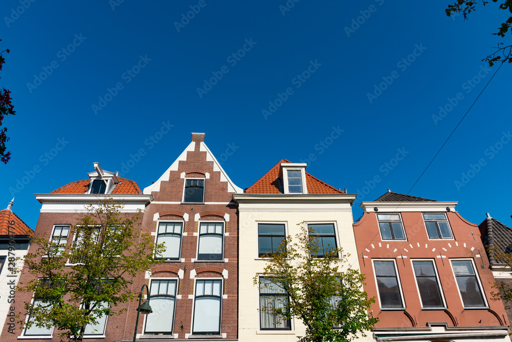 houses in street called Binnenwatersloot, in Delft, The Netherlands