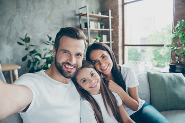 Self-portrait of nice attractive lovely sweet gentle adorable winsome charming cheerful cheery idyllic adopted foster family mommy daddy enjoying life indoors