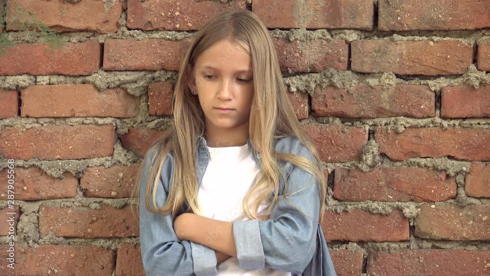 Sad Child, Not Playing Alone Kid, Unhappy Thoughtful Girl in Outdoor in Park Sad Child, Not Playing Alone Kid, Unhappy Thoughtful Girl in Outdoor in Park