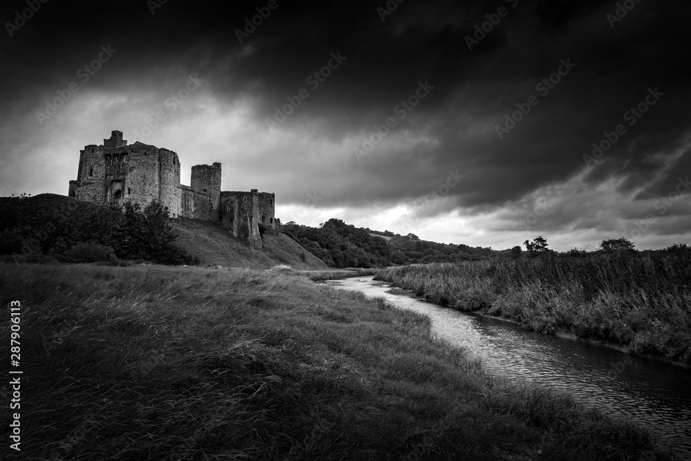 Kidwelly Castle, Kidwelly, Carmarthenshire, Wales, UK a Welsh ruin medieval castle of the 13th century black and white monochrome image