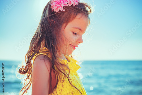 Little girl playing on the beach