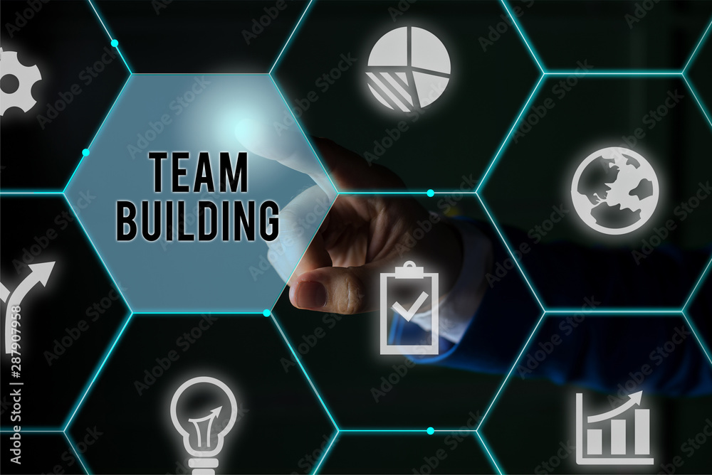 Fototapeta premium Text sign showing Team Building. Business photo showcasing various types of activities used to enhance social relations Male human wear formal work suit presenting presentation using smart device
