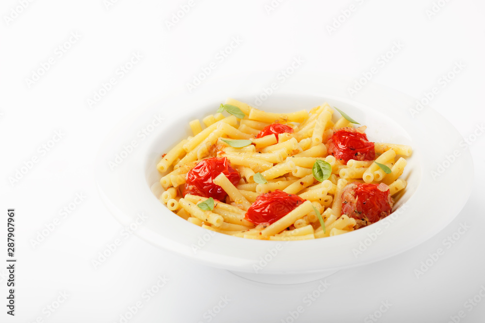 IItalian food background. Maccheroni pasta with tomatoes