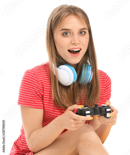 Teenage girl playing video ...