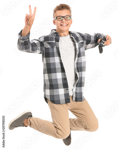 Jumping teenage boy with vi...