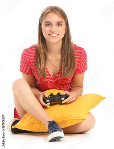 Teenage girl playing video ...