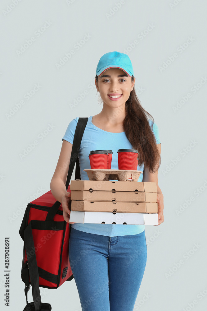 Female worker of food delivery service on white background Female worker of food delivery service on white background