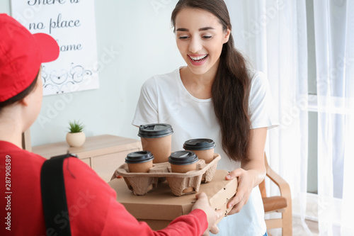 Woman receiving order from ...