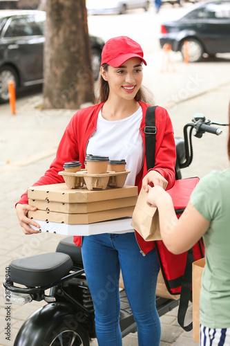 Woman taking order from cou...