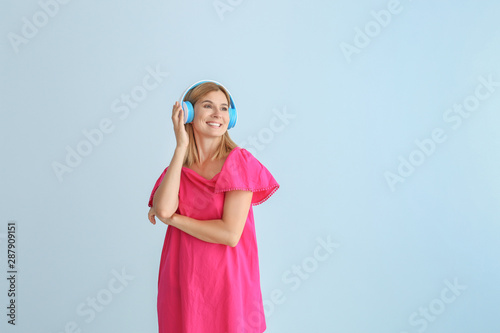 Happy beautiful woman liste...