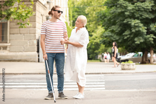 Wallpaper Mural Blind young man with mother walking outdoors Torontodigital.ca