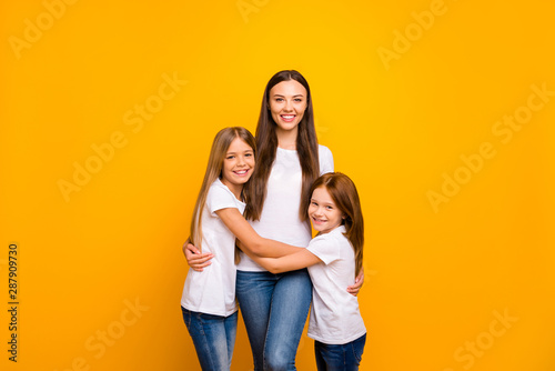 Photo of three sister ladies glad to be together at weekend wear casual outfit isolated yellow background