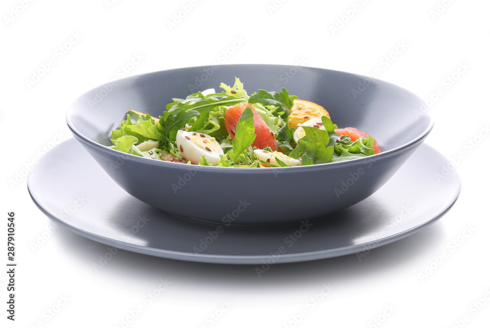 Plate of tasty fresh salad with quail eggs on white background Plate of tasty fresh salad with quail eggs on white background