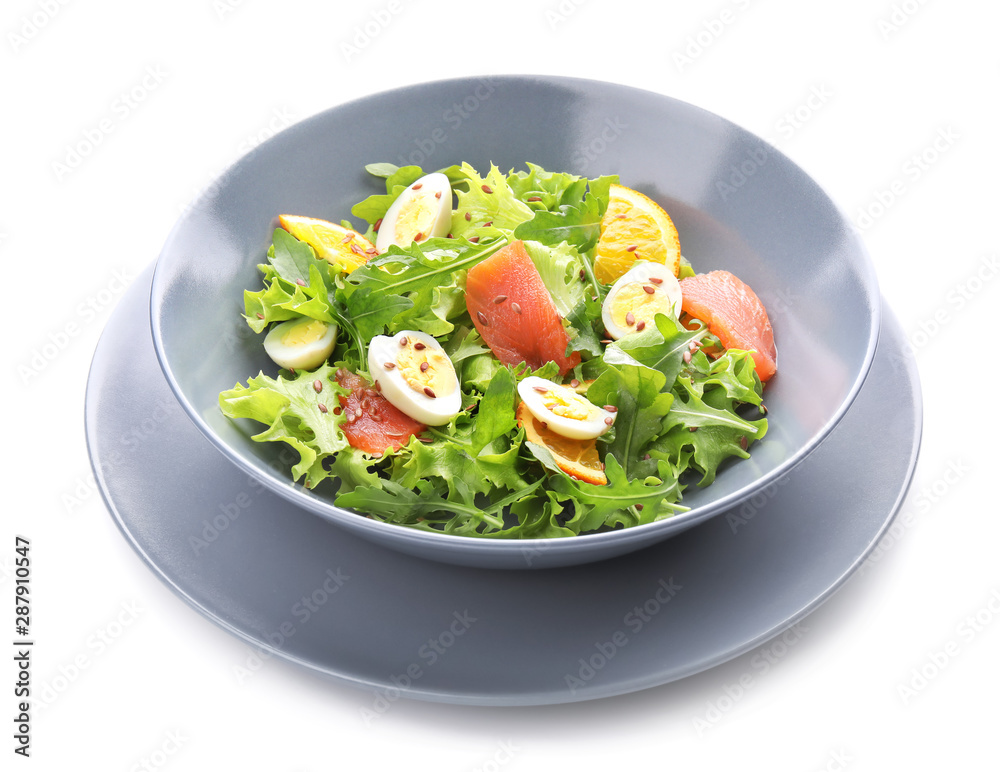 Plate of tasty fresh salad with quail eggs on white background Plate of tasty fresh salad with quail eggs on white background