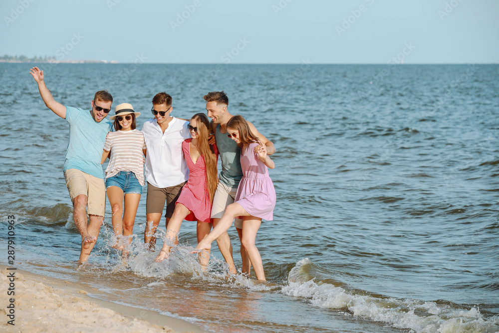 Happy friends on sea beach at resort Happy friends on sea beach at resort