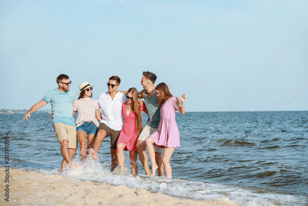 Happy friends on sea beach at resort Happy friends on sea beach at resort