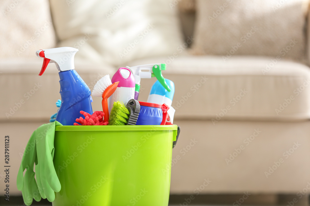 Bucket with cleaning supplies in room Bucket with cleaning supplies in room