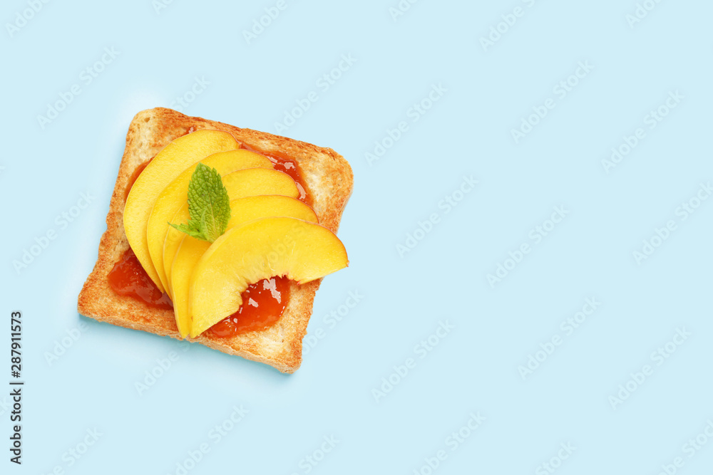 Tasty toasted bread with fruit jam on color background Tasty toasted bread with fruit jam on color background