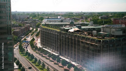 European Big City Street from high angle, high floor view. Weena Avenue in Rotterdam, The Netherlands. Sunny day, light traffic. photo