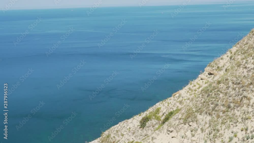Amazing view from high mountain cliffs to sea ocean, sliding camera Amazing view from high mountain cliffs to sea ocean, sliding camera