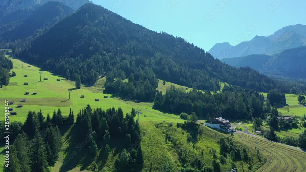 Aerial view of foot of Zugspitze mountain, highest peak of Germany and Wetterstein Mountains during summer - landscape panorama of Alps from above, Germany/Austria border, Europe Aerial view of foot of Zugspitze mountain, highest peak of Germany and Wetterstein Mountains during summer - landscape panorama of Alps from above, Germany/Austria border, Europe