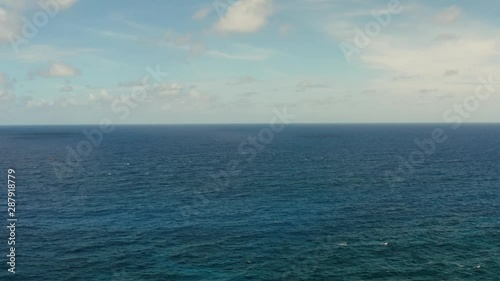 Wallpaper Mural Blue ocean with waves and blue skies with clouds. Blue water and sky landscape, top view. Water cloud horizon background. Torontodigital.ca