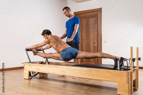 Pilates exercise on the reformer machine