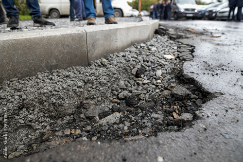 Wallpaper Mural Repair of asphalt in the yard of an apartment building. Renovation of the road. The details of the repair of asphalt roads. Torontodigital.ca