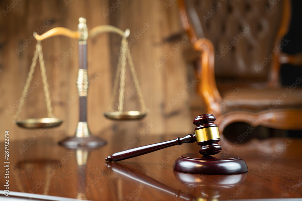 Law concept. Gavel of the judge and the scale on the wooden background. Law concept. Gavel of the judge and the scale on the wooden background.