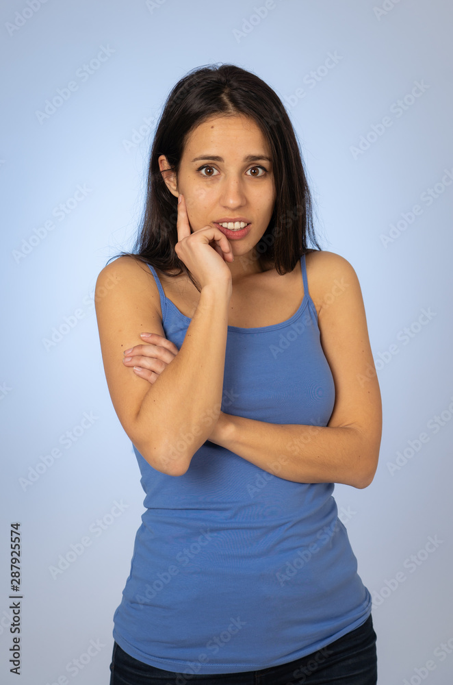 Portrait of young attractive woman with thoughtful expression thinking Portrait of young attractive woman with thoughtful expression thinking