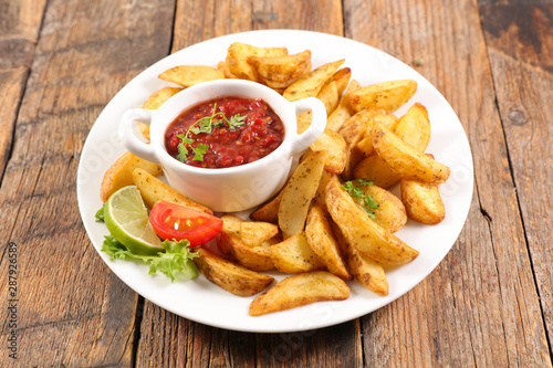 french fries and tomato sauce and vegetable salad