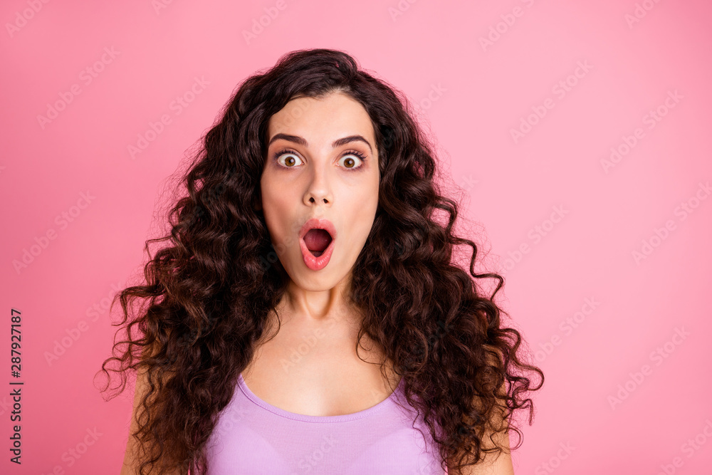 Close up photo of terrified shocked stunned girlfriend seeing something terrible with her eyes open wide while isolated with pink background