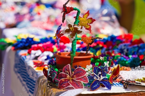 bright colorful handmade glass bead flowers, traditional folklore art at sale