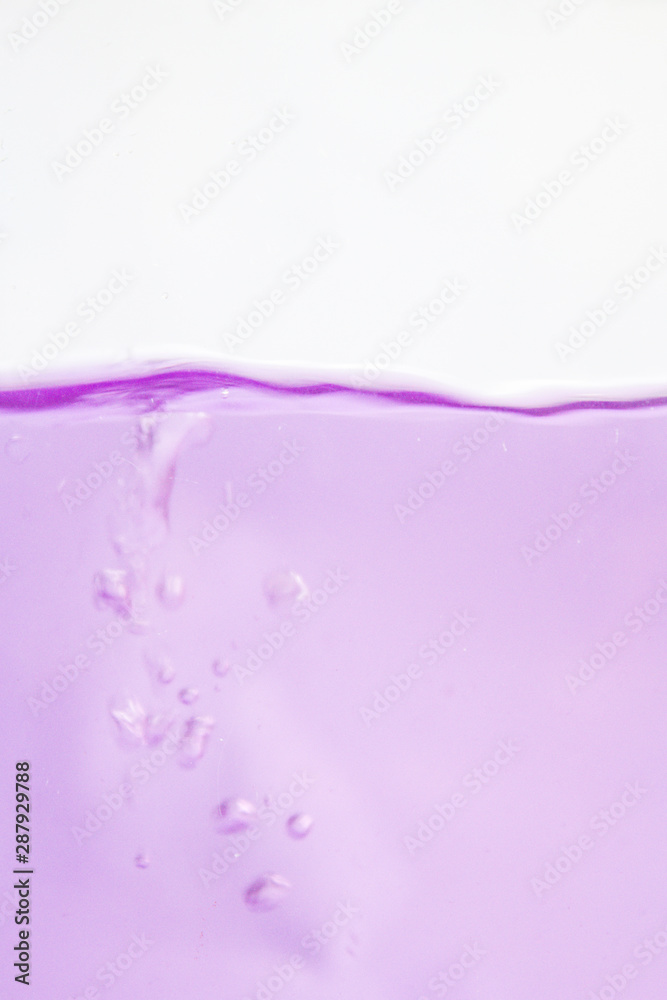 pink and rippled wave of liquid on white background 