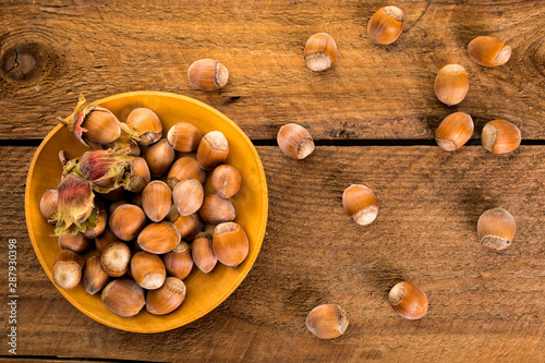 Freshly harvested hazelnuts on rustic table