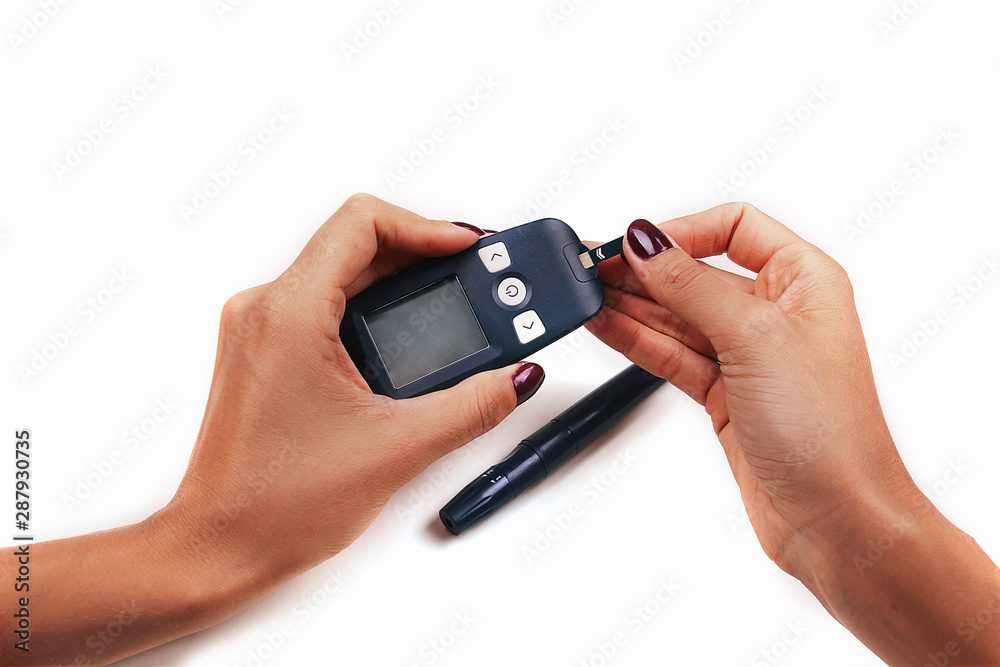 Diabetes patient measures blood glucose on white background. Diabetes patient measures blood glucose on white background.