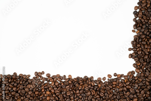 Fototapeta Naklejka Na Ścianę i Meble -  Coffee beans frame with beans at the bottom and right side on a white background