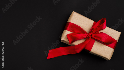 Flat lay of present on black background